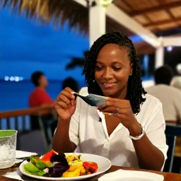 Caribbean Holidays, Solo Holidays, A friendly solo traveller dining at an open-air Caribbean restaurant in Saint Kitts, with local food and a relaxed evening atmosphere