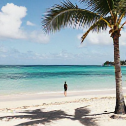 Caribbean Holidays, Solo Holidays, Solo traveller enjoying a quiet beach on Saint Martin in warm November sunshine, turquoise sea and palm trees