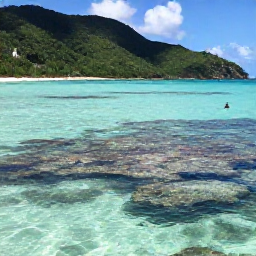 Caribbean Holidays, Trinidad Adventure Holidays, A scenic Caribbean beach in Tobago with a snorkeller near a coral reef, clear turquoise water and green hills in the background