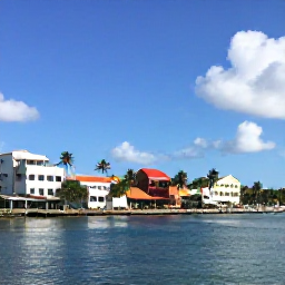 Caribbean Holidays, Trinidad Business Class, Sunny Port of Spain waterfront in April, palm trees, colourful buildings, calm Caribbean atmosphere