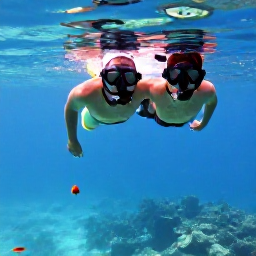 Caribbean Holidays, Trinidad Honeymoons, Couple snorkelling in clear Caribbean water near Tobago, colourful fish and coral visible beneath the surface