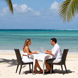 Caribbean Holidays, Trinidad Honeymoons, Romantic beachfront resort in Tobago with a couple dining at an outdoor table overlooking the sea