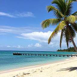 Caribbean Holidays, Trinidad Instagram Hotspots, Turquoise sea, pale sand and swaying coconut palms at Pigeon Point beach in Tobago, with a wooden jetty extending into calm water