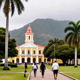 Caribbean Holidays, Trinidad January Breaks, Visitors walking through Queen's Park Savannah in Port of Spain, with palm trees, historic buildings and the Northern Range mountains in the background