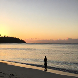 Caribbean Holidays, Trinidad January Wellness, Quiet tropical beach in Trinidad and Tobago at sunrise, calm turquoise water, soft golden light, peaceful wellness holiday atmosphere