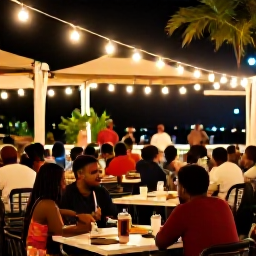 Caribbean Holidays, Trinidad July Breaks, A relaxed evening in Port of Spain with outdoor dining, warm lights, live music and people enjoying Trinidadian culture