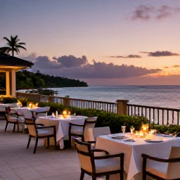 Caribbean Holidays, Trinidad Luxury Holidays, Elegant luxury hotel terrace overlooking the Caribbean Sea at sunset in Trinidad and Tobago, with dining tables and soft evening lighting
