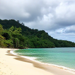 Caribbean Holidays, Trinidad October, Tropical Tobago coastline with rainforest-covered hills, turquoise sea and a quiet sandy beach after a rain shower