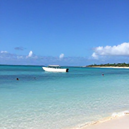 Caribbean Holidays, Turks and Caicos March, Small boat exploring calm turquoise water near the Caicos Islands, with snorkellers and a distant beach