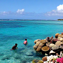 Caribbean Holidays, Turks Caicos All Inclusive, Snorkellers exploring a colourful coral reef with tropical fish in clear shallow water near Providenciales, Turks and Caicos