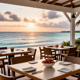Caribbean Holidays, Turks Caicos Beaches, A relaxed beachside restaurant at sunset in Providenciales, with outdoor tables, fresh seafood and views across the sea