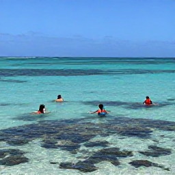 Caribbean Holidays, Turks Caicos Beaches, Visitors swimming and snorkelling over a shallow coral reef in transparent Caribbean water near Providenciales