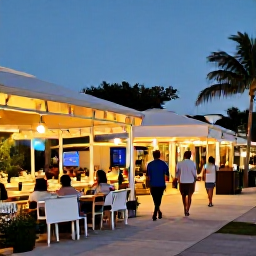 Caribbean Holidays, Turks Caicos July, A friendly evening scene in downtown Grace Bay, with outdoor restaurants, soft lights and holidaymakers walking between shops