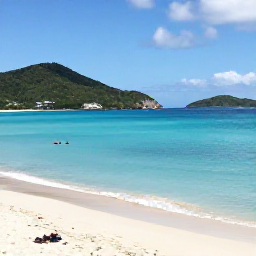 Caribbean Holidays, US Virgin Islands Beaches, Sunny beach scene on Magens Bay, St Thomas, with calm turquoise water, green hills and a few relaxed holidaymakers