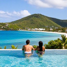 Caribbean Holidays, Virgin Islands Spa Breaks, A couple relaxing beside an infinity pool on St Thomas, looking over green hills and a bright blue Caribbean bay